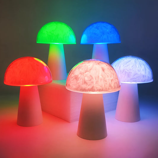 Mushroom-shaped RGB colour-changing night light with remote control on a wooden surface