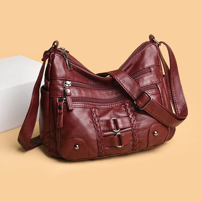 PU shoulder messenger bag with single strap, open outer pocket, and zip inner compartment in black, red, brown, or beige.