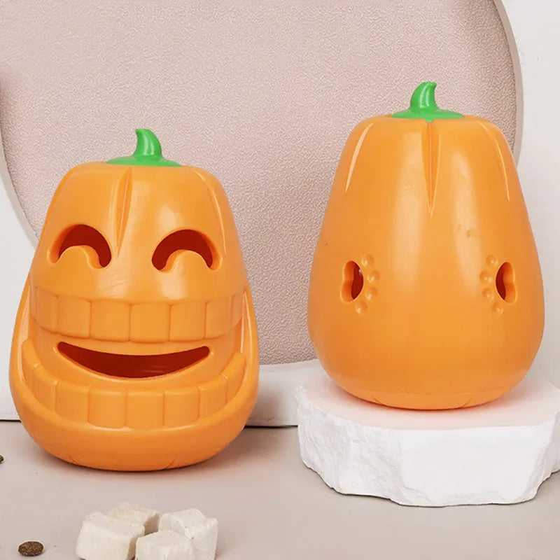 Halloween pumpkin-shaped dog chew toy with treat-dispensing funnel, made from orange thermoplastic rubber
