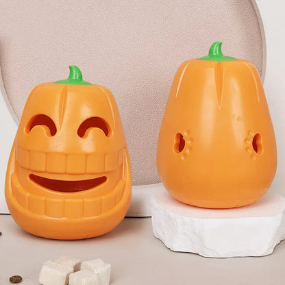 Halloween pumpkin-shaped dog chew toy with treat-dispensing funnel, made from orange thermoplastic rubber