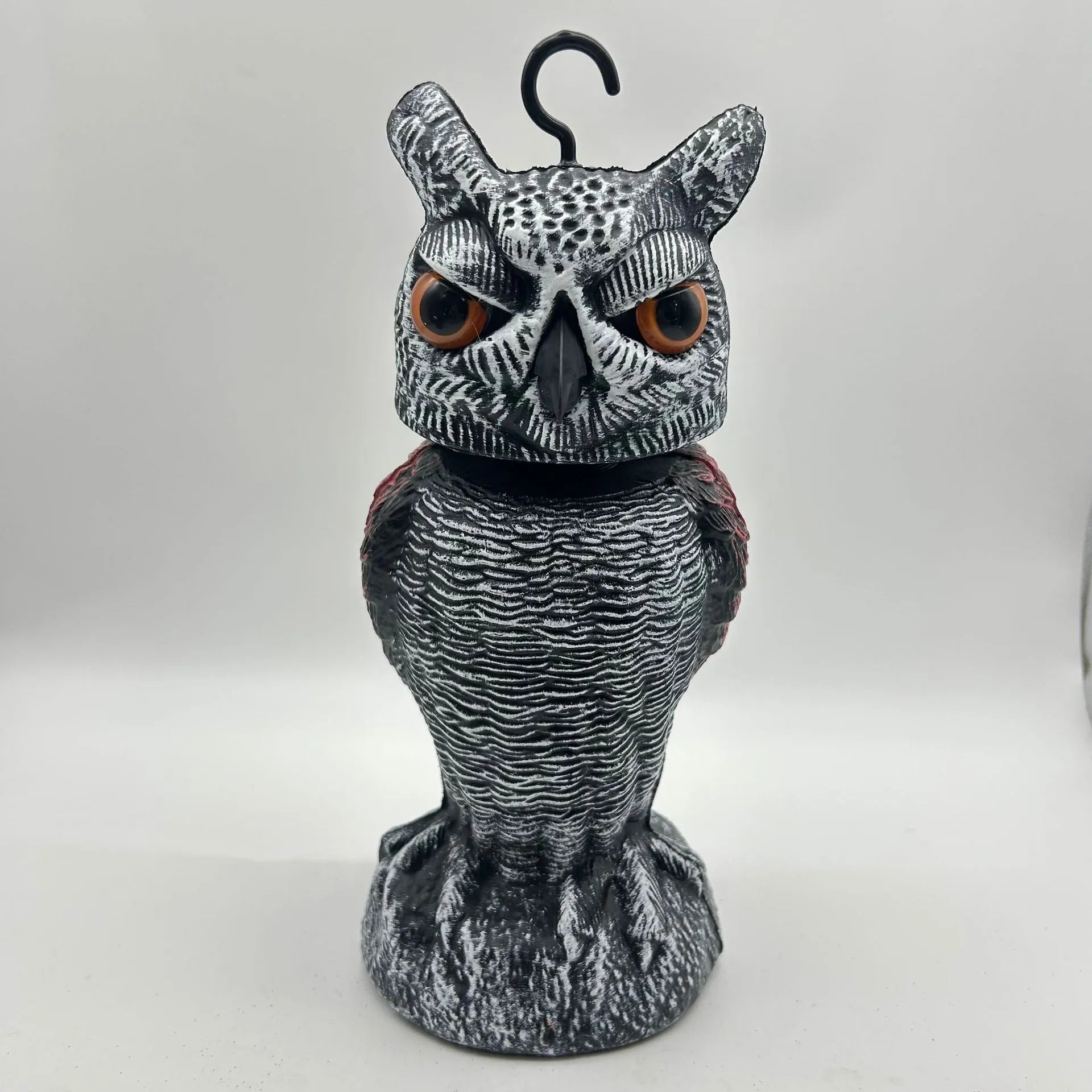 Set of artificial owl bait ornaments with shaking heads for scaring birds outdoors.