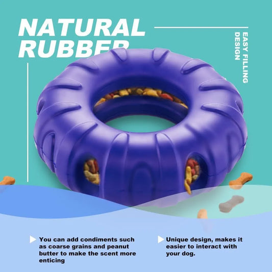 Blue tyre-shaped dog chew toy with oval openings, made from natural rubber for slow feeding