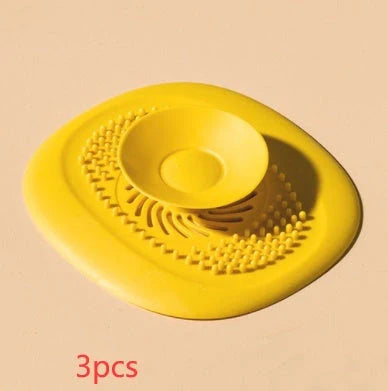 TPR vortex design sink drain cover in twilight orange, quiet blue, mango yellow, and gentian green
