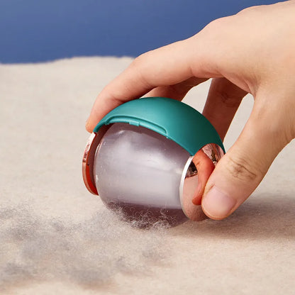 Green Gold reusable gel lint roller ball for removing pet hair from fabrics.