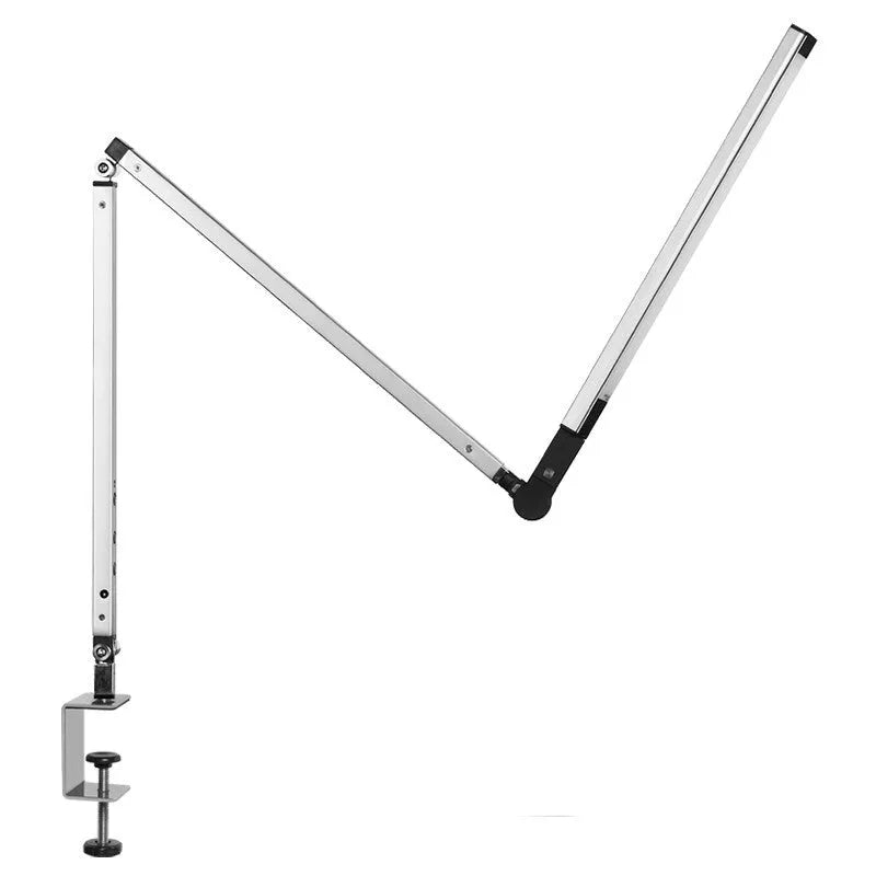 Clip-on adjustable arm LED desk lamp in black mounted on a desk edge with remote control.