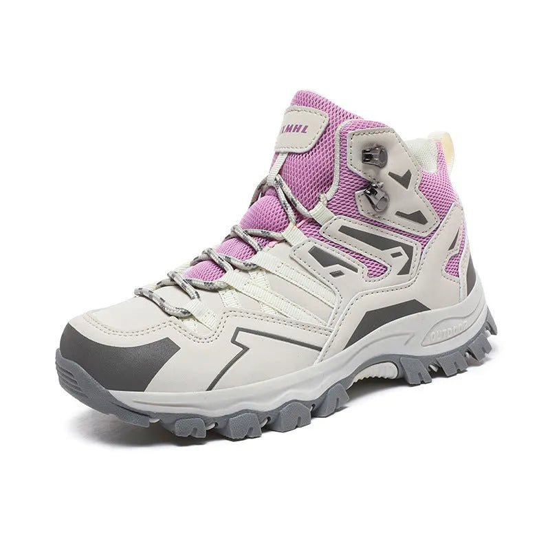 Low-top hiking sneaker in multiple colours on a rocky mountain path, showing lace-up front and rubber sole.
