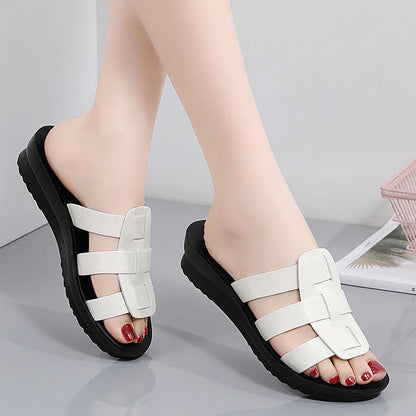 Women's large size flat bottom slippers in beige, black and brown colours with PU leather construction