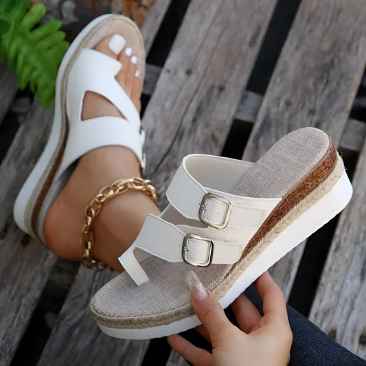 White patent leather wedge sandals with peep toe and finger fit design