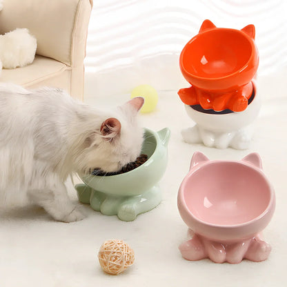 Black and white ceramic cat bowl with oblique mouth and neck guard for reduced whisker fatigue