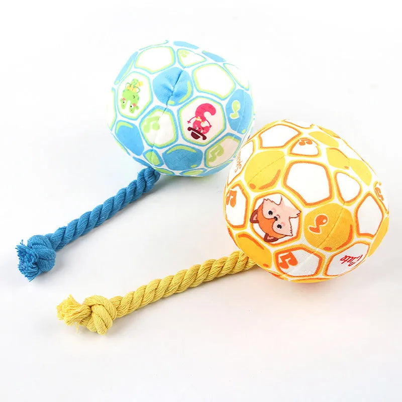 Blue and yellow elastic football dog toy with an attached cotton rope for tug of war and chewing.