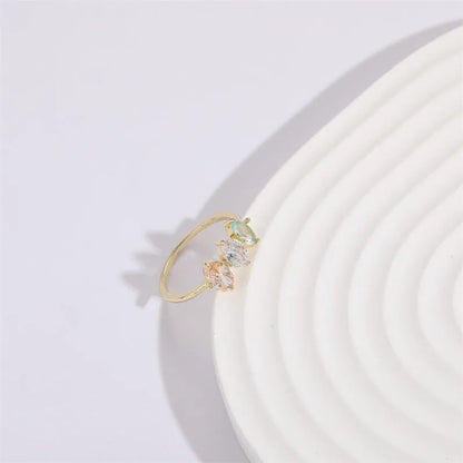 Geometric women's copper ring with triangle design, tricolour zircon stones, and birthstone in electroplated gold finish