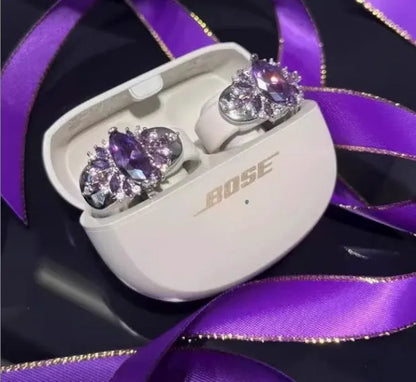 Zircon earphone clip in silver plate with electroplated finish, shown in pink, purple or gold with heart or geometric shape.