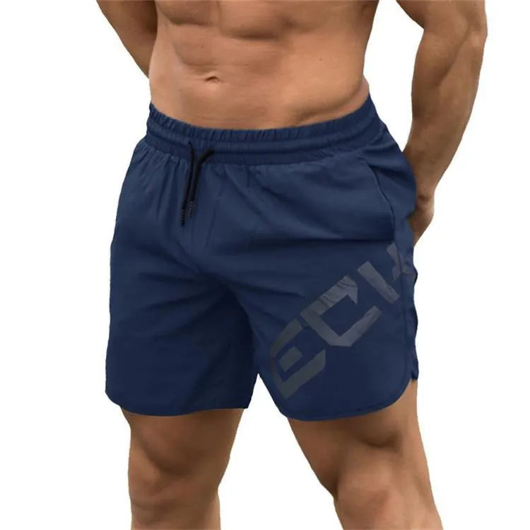 Men's black quick-dry training shorts with elastic waistband, shown knee-length.
