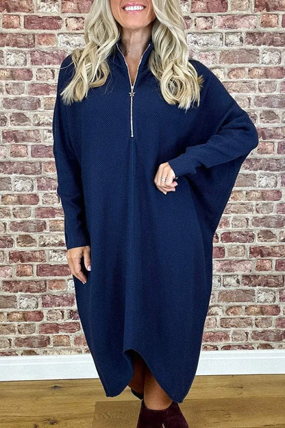 Women's solid colour loose fit knitted dress with raglan sleeves and a front zipper.