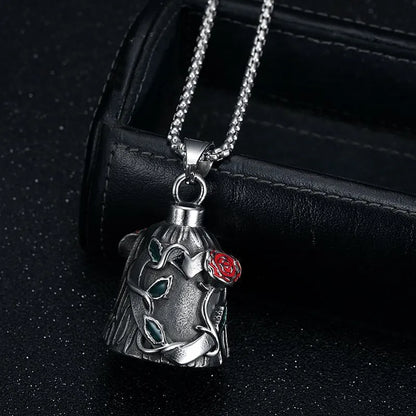 Polished titanium steel motorcycle lucky bell with a red epoxy rose design in a geometric shape, shown on handlebars.