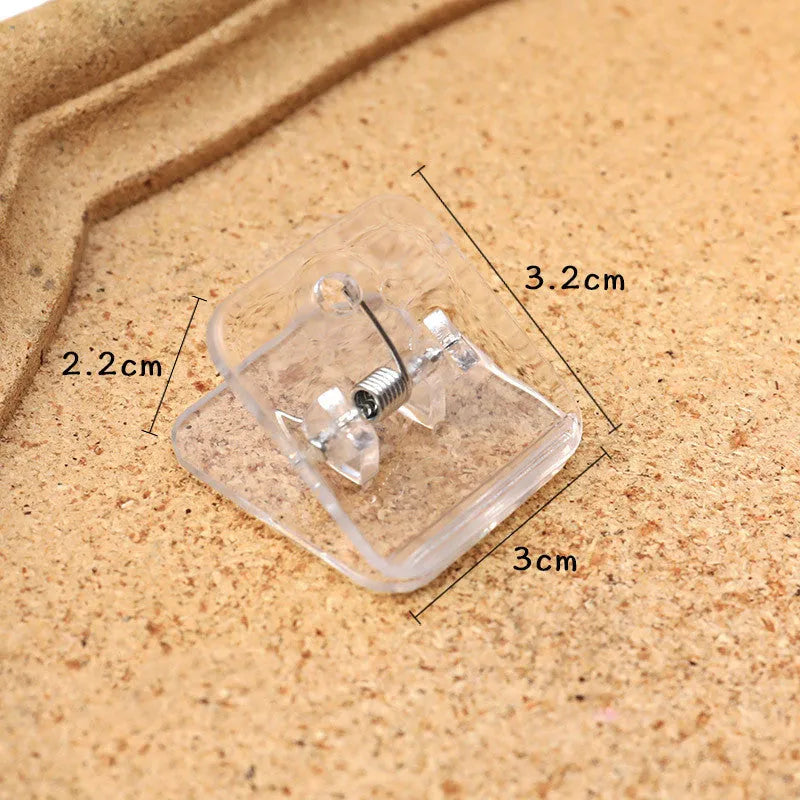 Square plastic photo holder in black, white, and transparent colour options on desk