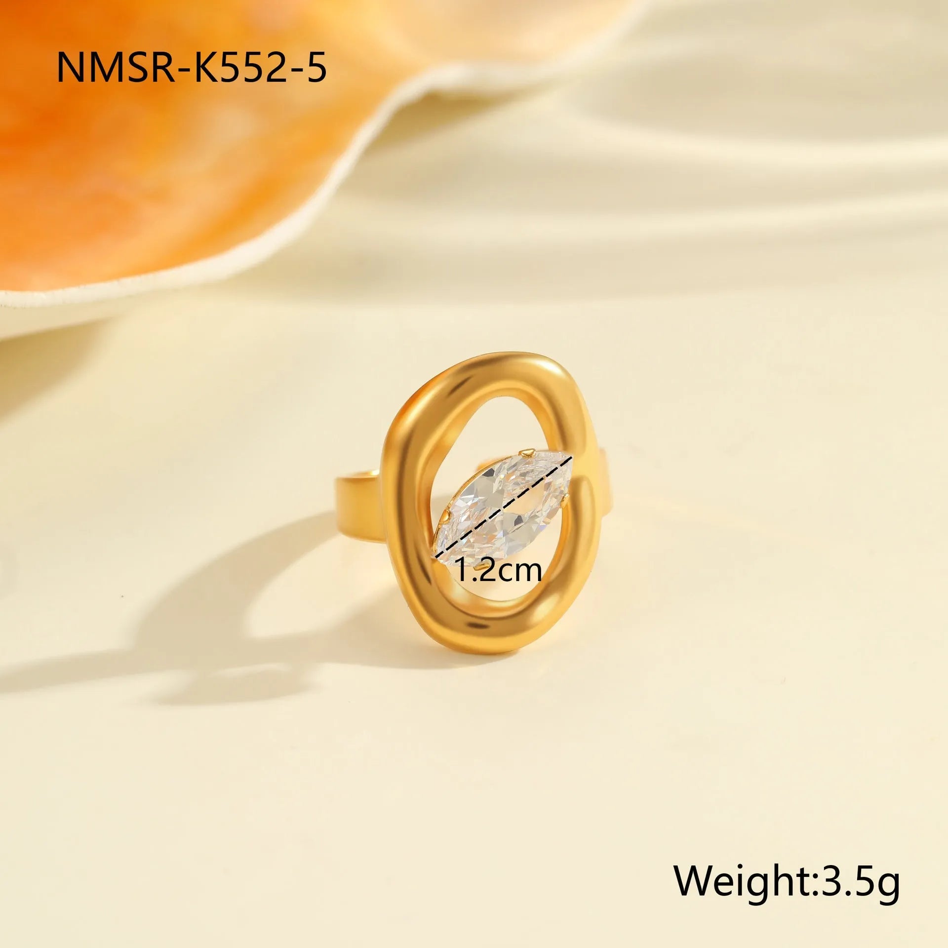 Geometric zircon ring showing round, oval and quadrangular design elements in stainless steel with electroplated finish