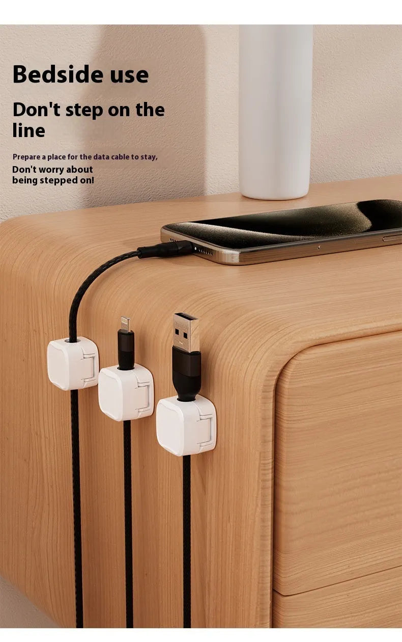 Black and white magnetic cable clips for under desk cable management with adhesive backing