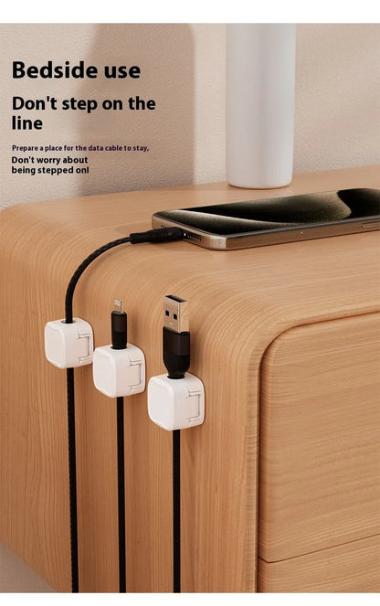 Black and white magnetic cable clips for under desk cable management with adhesive backing