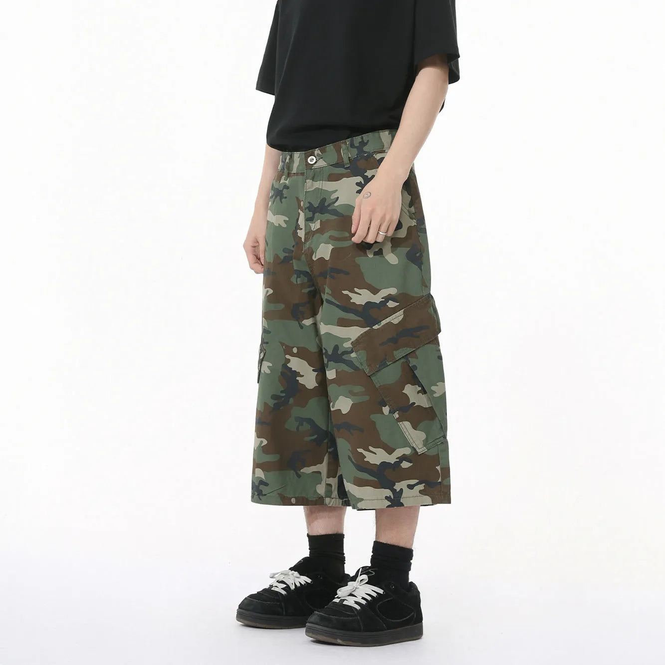 Men's camouflage pattern cotton jeans with wide-leg loose fit and cropped length, showing large side pockets
