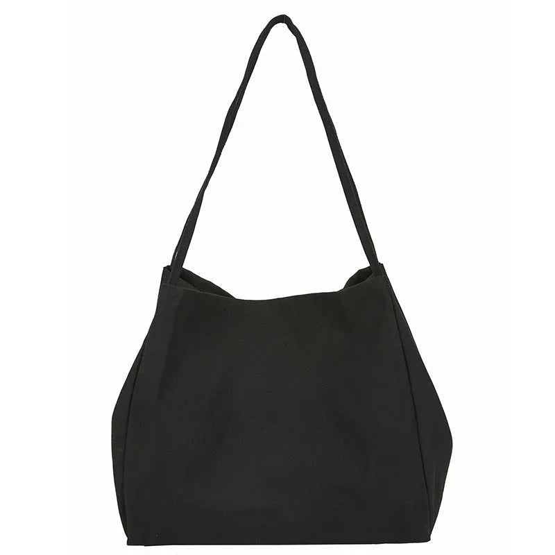 Solid colour women's canvas handbag with double shoulder straps showing internal mobile phone compartment