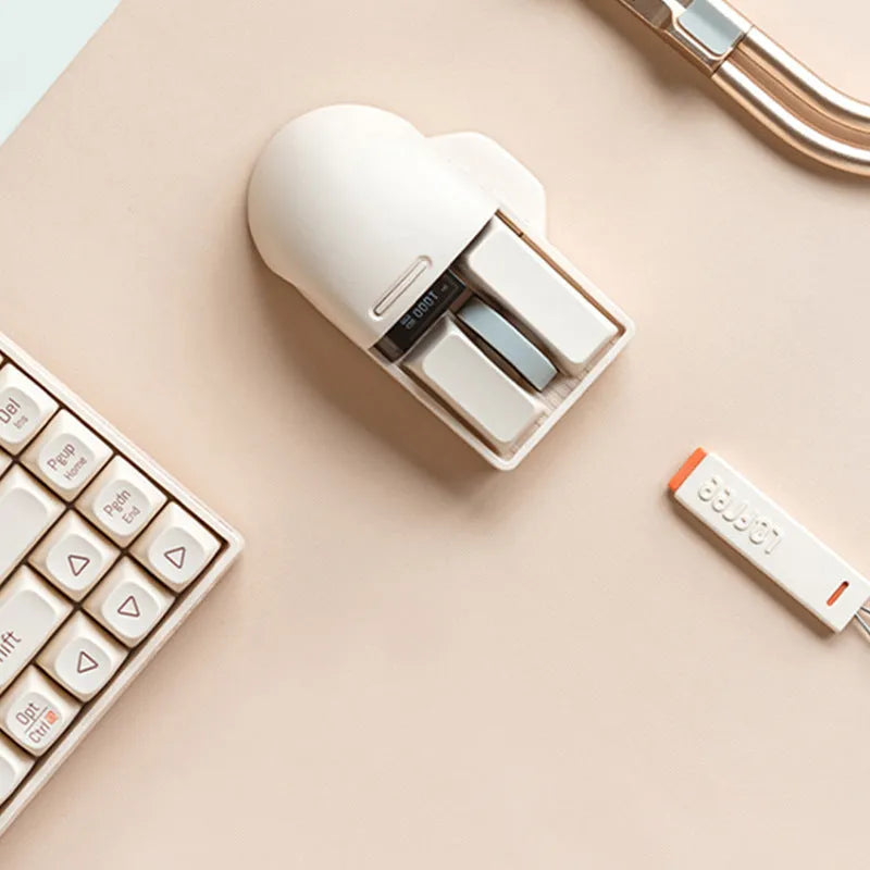 Xiaoqiao wireless mouse in tofu colour with ergonomic shape and four-way roller on desk