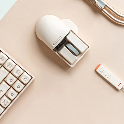 Xiaoqiao wireless mouse in tofu colour with ergonomic shape and four-way roller on desk