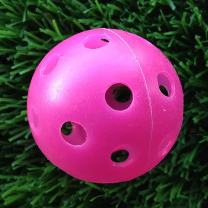 Hollow plastic golf practice balls in various colors for indoor use