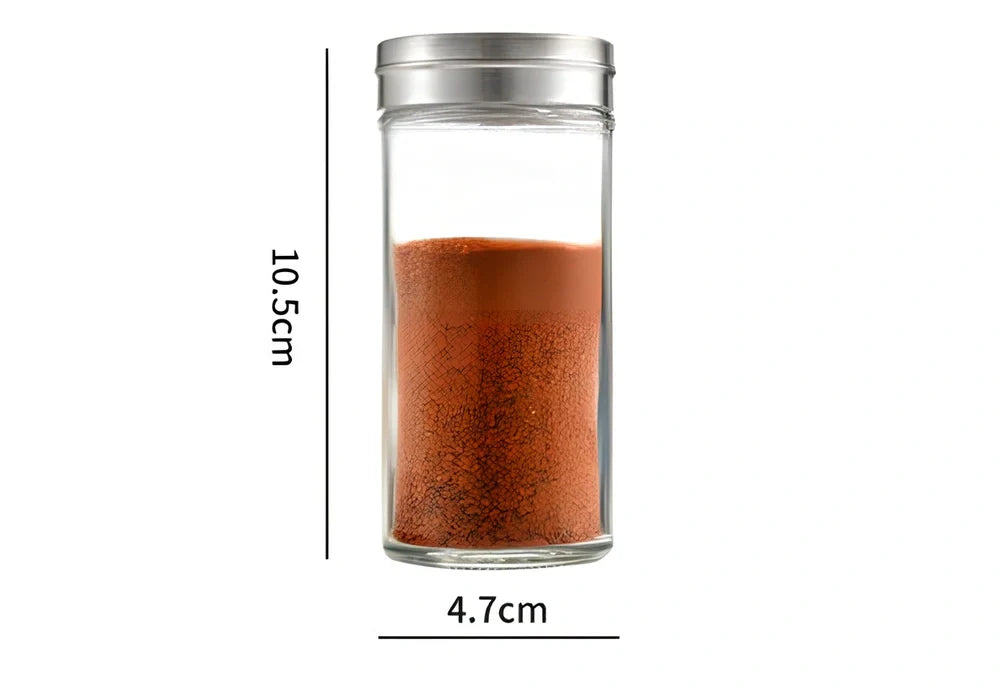 White plastic hanging spice rack with six clear glass bottles, mounted on kitchen door for punch-free storage