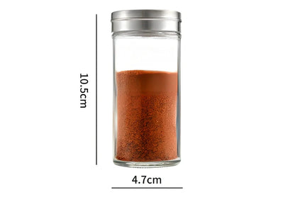 White plastic hanging spice rack with six clear glass bottles, mounted on kitchen door for punch-free storage