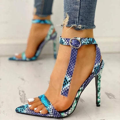 Blue women's high heels with a buckle strap and hollow-out pattern on the PU leather upper.