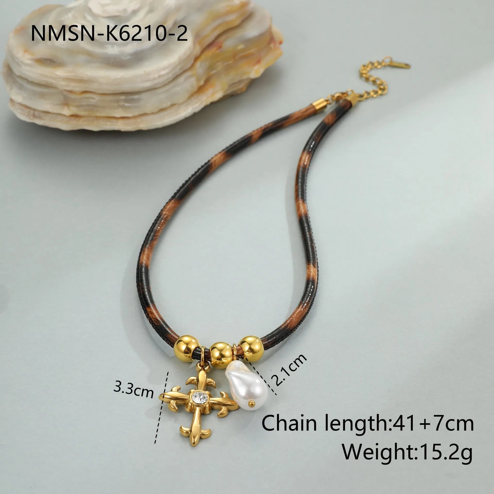Geometric leopard print pendant on a stainless steel chain necklace for women.
