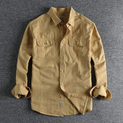 Men's light blue cotton cardigan-style long sleeve casual shirt on a hanger