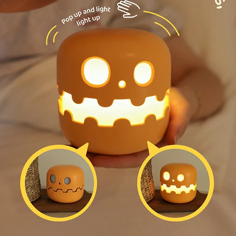 Pumpkin-shaped nightlight with soft silicone construction and warm, soothing glow for creating a cozy Halloween atmosphere