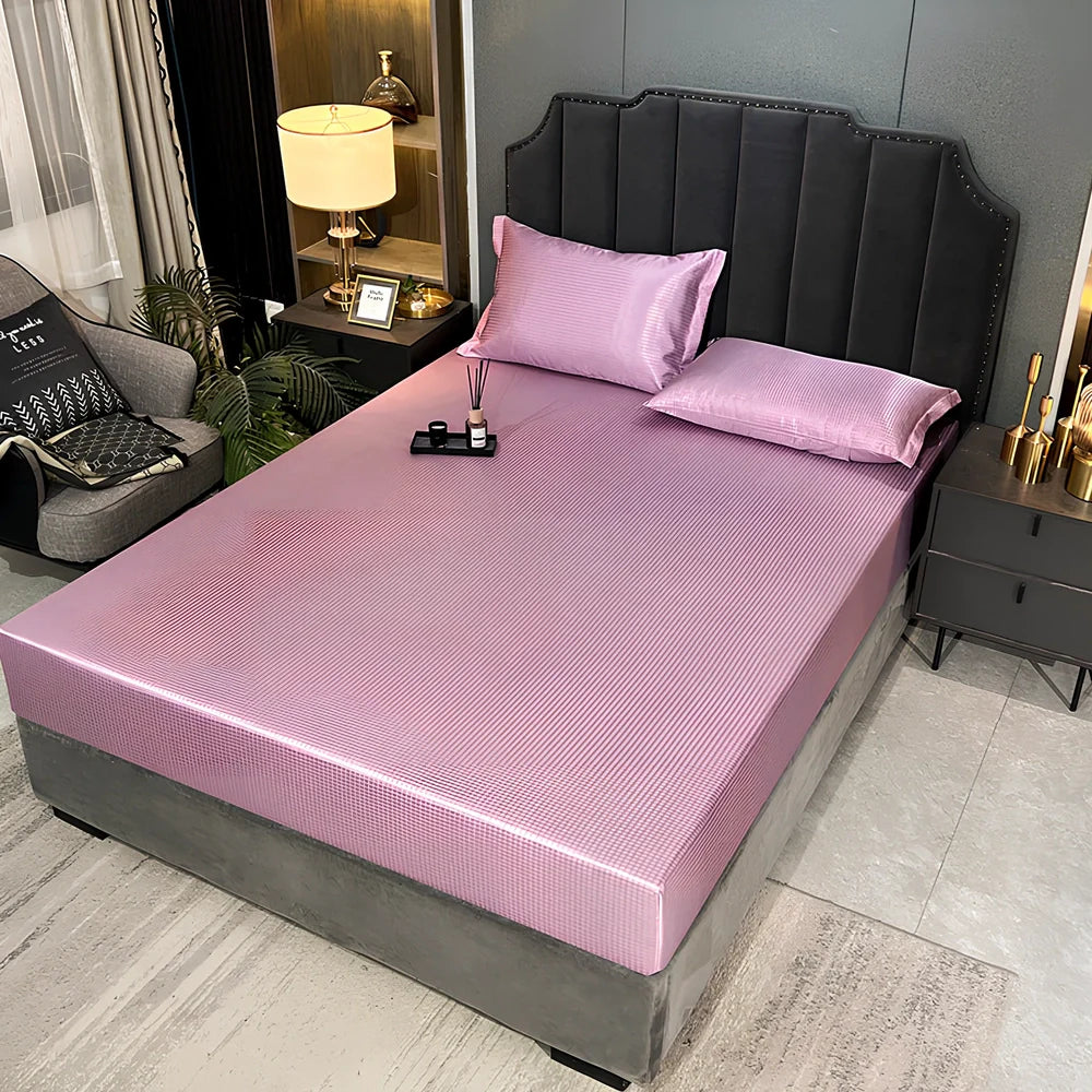 Houndstooth ice silk jacquard fitted three-piece bedding set in ice blue, 180x200cm size with pillowcases on white bed