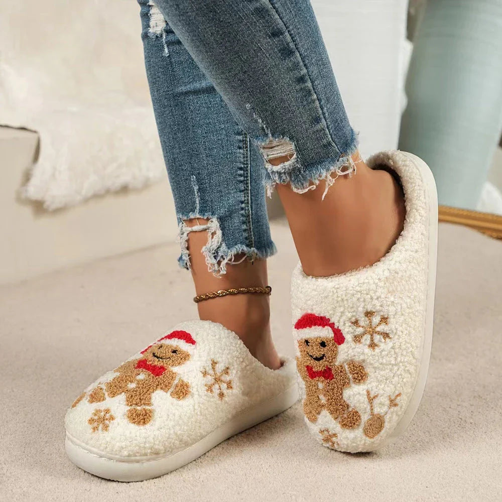 Cozy plush gingerbread slippers with festive snowflake patterns, designed for comfortable indoor wear during the winter season.