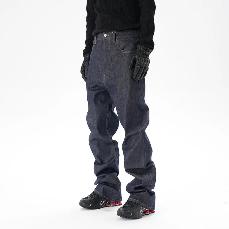 Man wearing dark blue loose-fit straight-leg denim jeans, showcasing the casual relaxed silhouette.