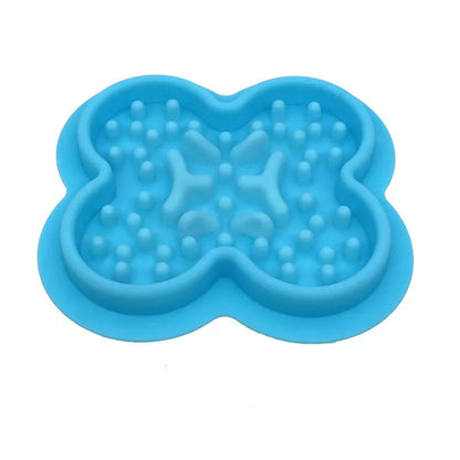 Silicone pet licking mat in green with textured surface and suction cups on base
