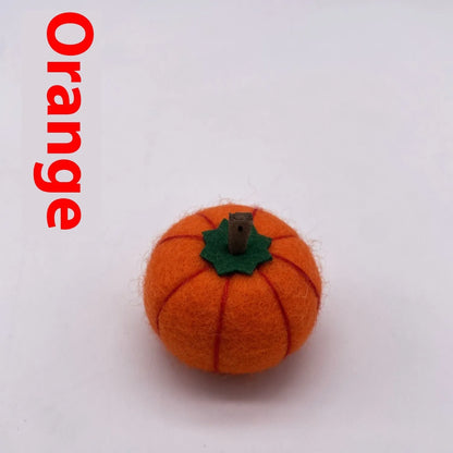 Wool felt pumpkin ornaments in various colours for doll decoration and craft projects.