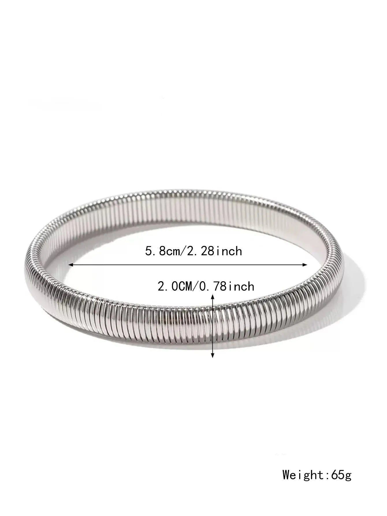 Women's titanium steel elastic bracelet with a vertical stripe pattern in gold, shown on a wrist.