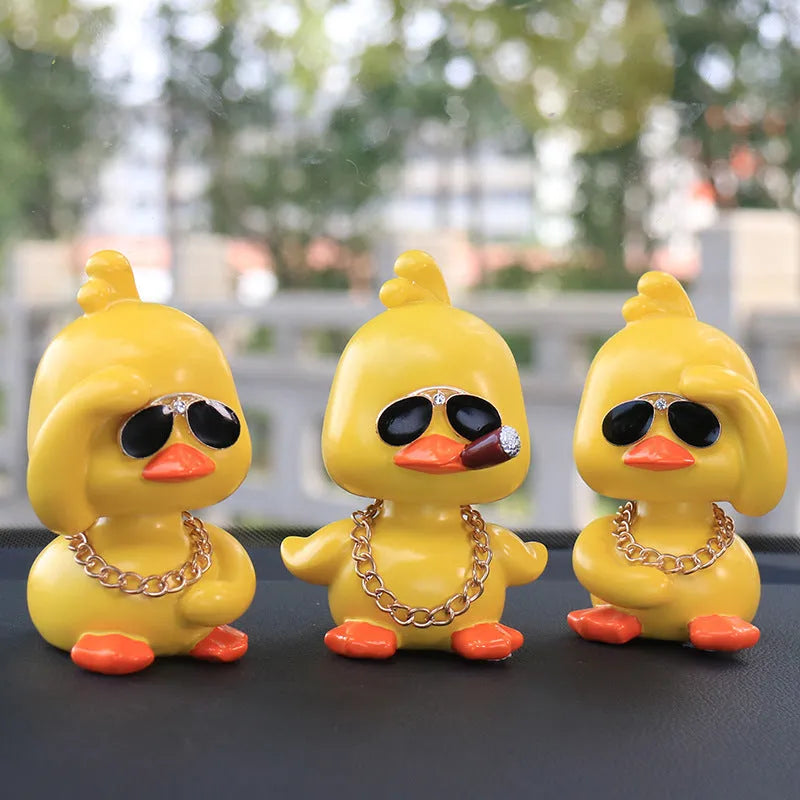 Little yellow duck resin car interior ornament in social duck poses with gold glasses and gold necklace