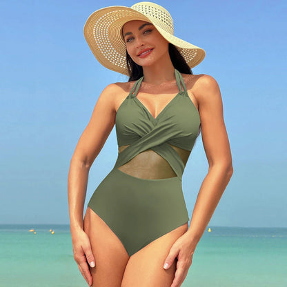 Halter one-piece swimsuit with cross-strap design, available in various solid colors and leopard print
