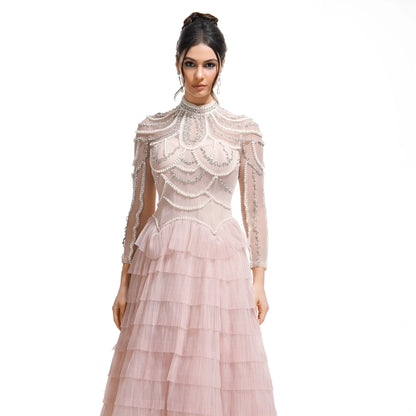 Women's long sleeve black beaded dress with 3D decoration and a mid waist.