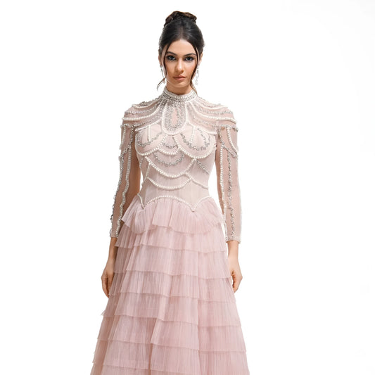 Women's long sleeve black beaded dress with 3D decoration and a mid waist.