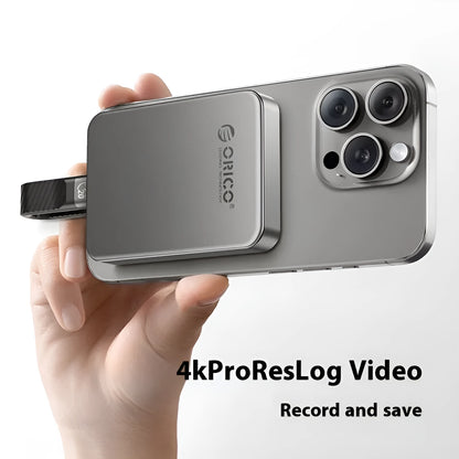 Grey magnetic mobile solid state drive with ultra-thin design and magnetic suction ring for phones and computers