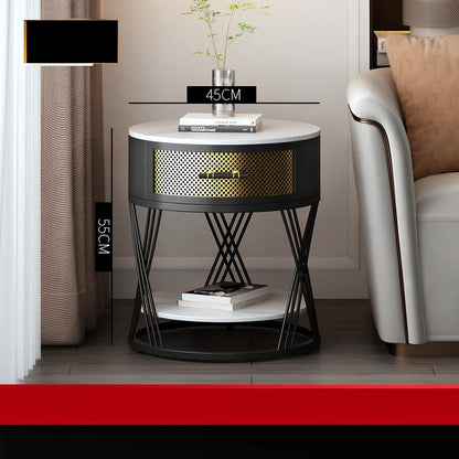 Round coffee table with slate surface and metal frame, featuring integrated storage compartment