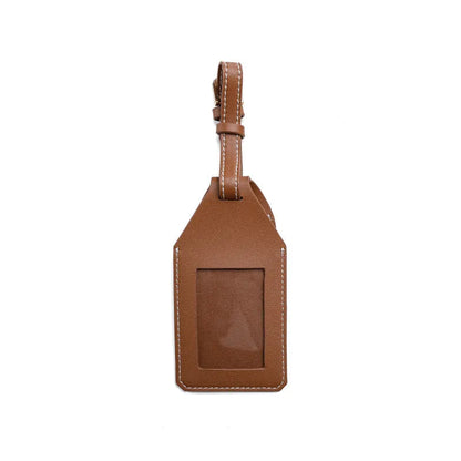 Luggage tag tracker protective cover in black, brown, and orange colours made from PU/PVC material.
