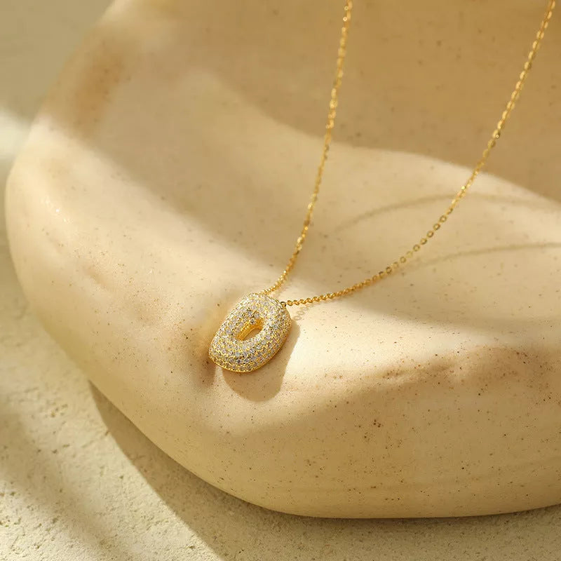 Stainless steel initial pendant necklace with zircon accents, personalized with your choice of letter.