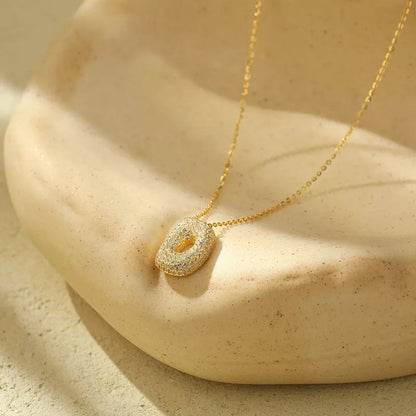 Stainless steel initial pendant necklace with zircon accents, personalized with your choice of letter.