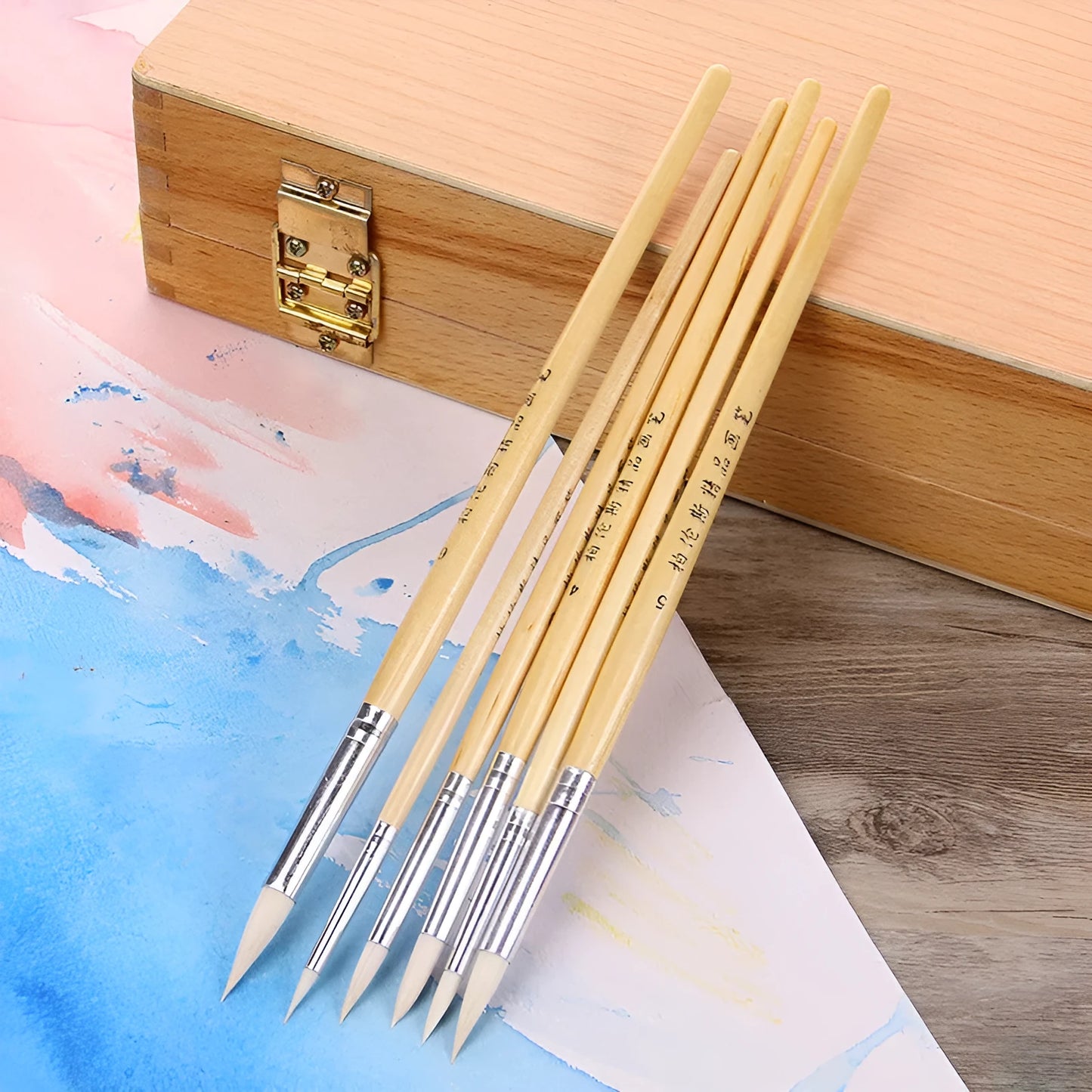 Six wooden pen brushes with pointed hook line design and wool bristles arranged together